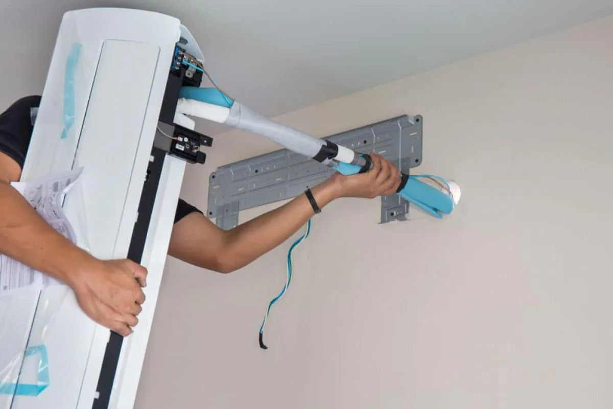 AC unit being installed by technician